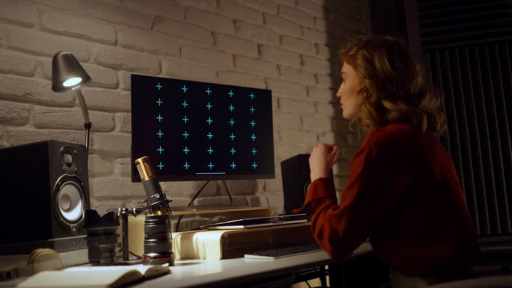 Focused Young Woman Engaged in Creative Studio Work