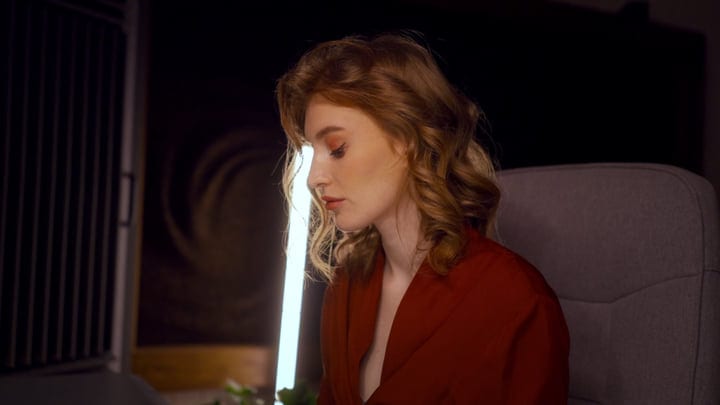 Focused Artist Immersed In Creative Studio Lighting