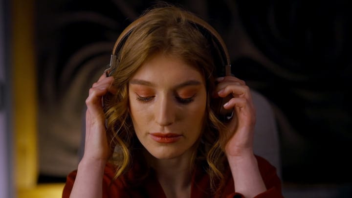 Young Woman Immersed In Music During Studio Session