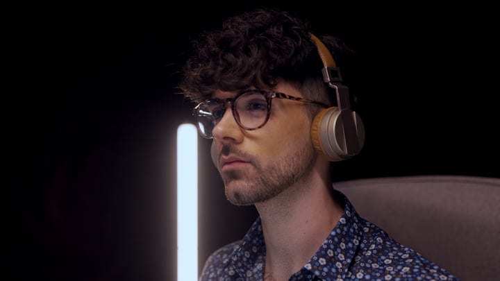 Focused Music Producer Immersed In Studio Session