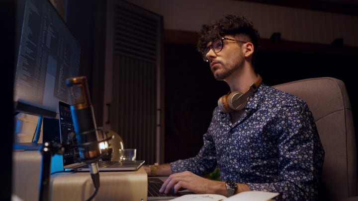 Focused Music Producer at Work in Studio Environment