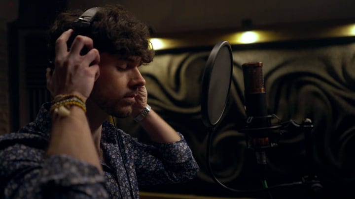Focused Artist Immersed in a Studio Recording Session