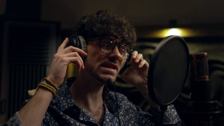 Focused Musician Immersed in Studio Recording Session