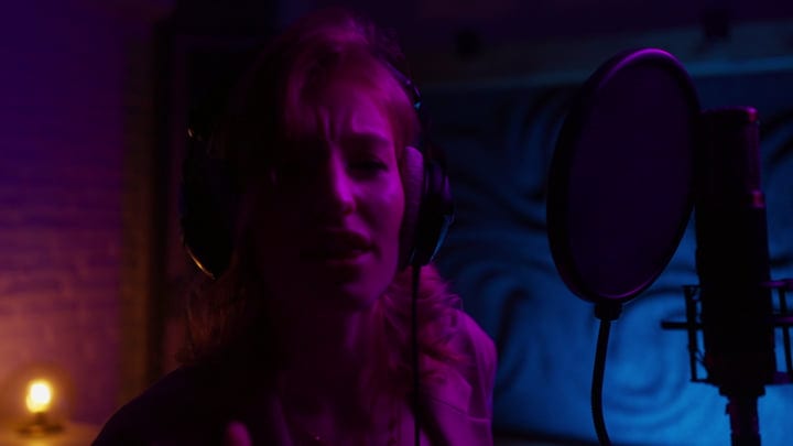 A Vocalist Immersed In Her Studio Performance