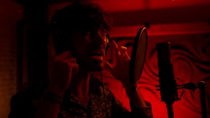 Passion Ignites Under Red Lights In Recording Studio