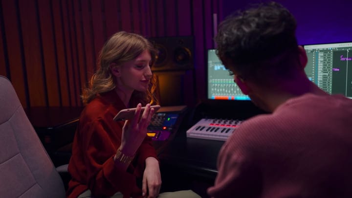 Creative Collaboration Unfolds In A Modern Studio Setting