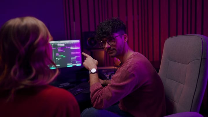 Producer Points Out Progress In Studio Session