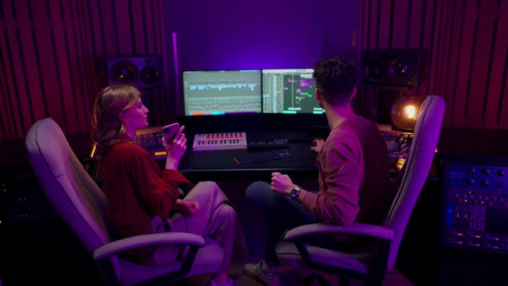 Creative Minds Collaborating In A Modern Music Studio