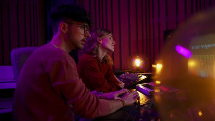 Creative Minds Collaborate In A Vibrant Music Studio