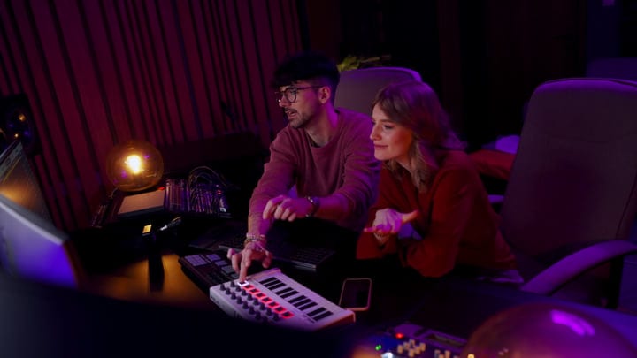 Creative Duo Perfecting Their Sound In Studio Harmony