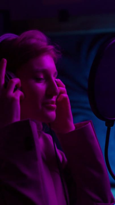 Young Creative Immersed in Studio Magic at Night