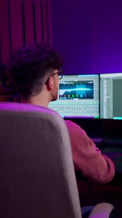 Focused Producer Immersed In Creative Studio Vibes