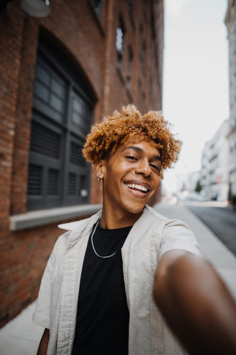 Joyful Urban Stroll Captured Amidst Brick Facades