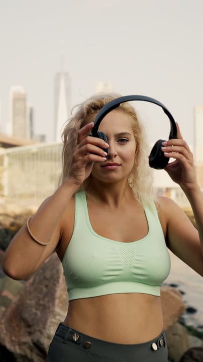 Runner Adjusts Headphones In Vibrant New York Morning