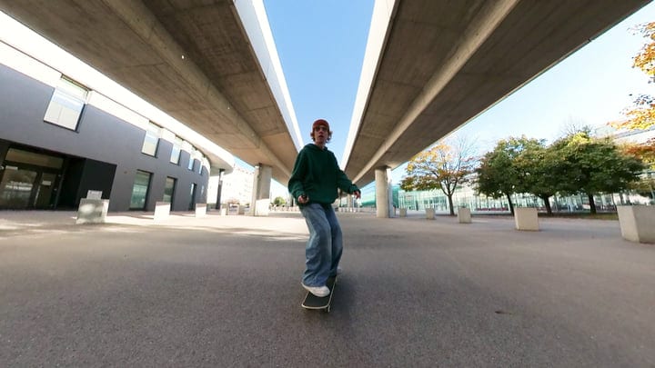 Skateboarder Finds Freedom Beneath Urban Overpass