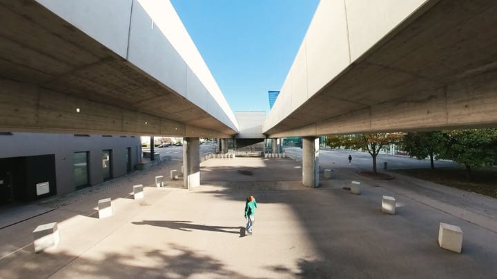 Urban Dancer Finds Solitude Beneath Concrete Giants