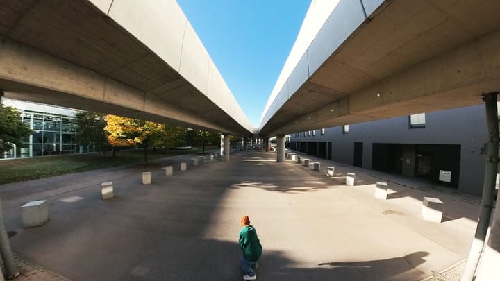 Autumn Sunlight Guides A Solitary Skateboarder Under Bridges