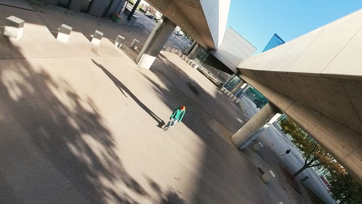 A Solitary Dancer Moves Through Urban Geometry