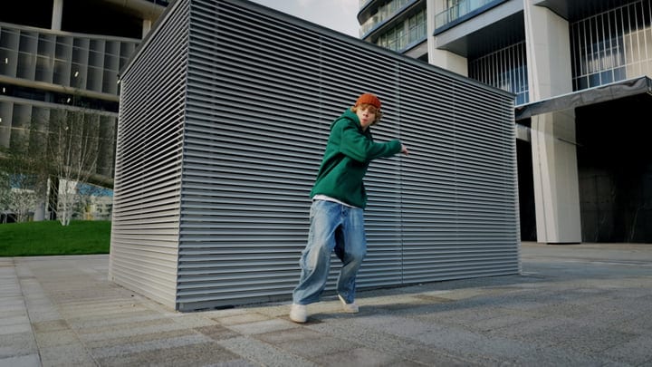 Urban Dancer Moves in Front of Modern Architecture