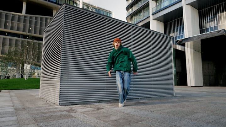 Street Dancer Embraces Urban Pulse In Modern Cityscape