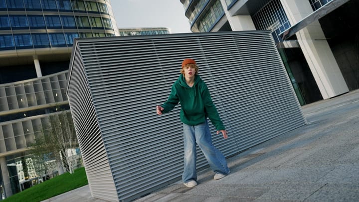 Energetic Street Dancer Expresses Freedom in Urban Setting