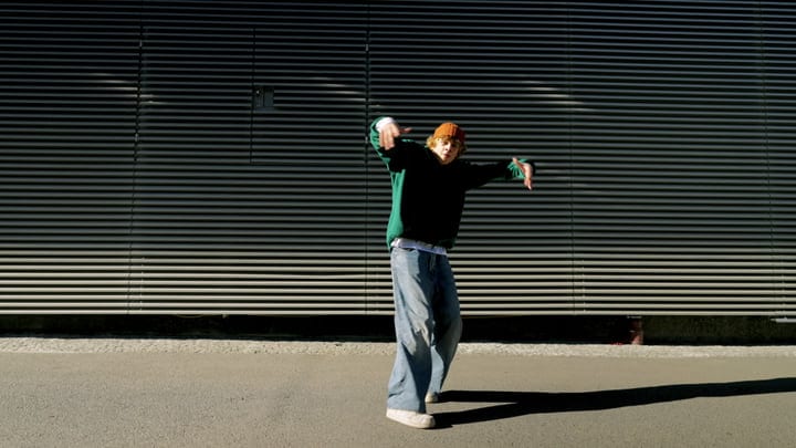 Expressive Dance Moves Under City Lights At Night