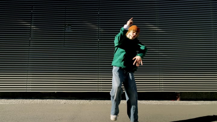 Street Dancer Catches Sunlight With Energetic Moves At Dusk