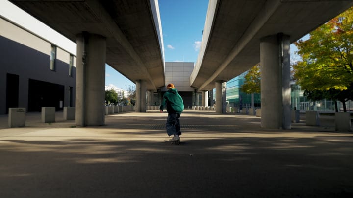 Urban Dancer Moves Under Concrete Bridges At Dusk