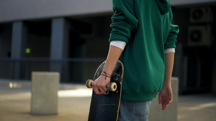 Urban Skater Prepares For A Night Of Tricks