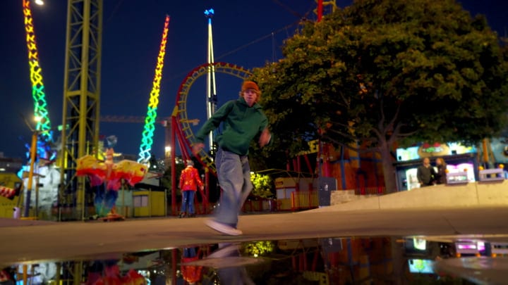 Urban Dancer Moves Under Neon Carnival Lights