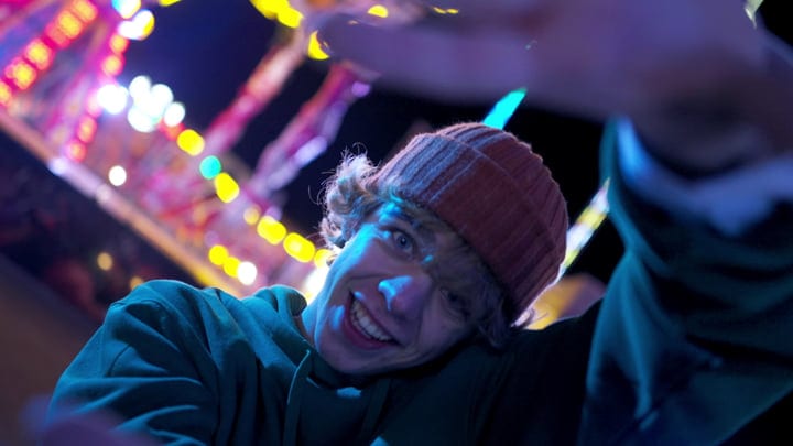 Joyful Street Dancer Under Neon Nightlights