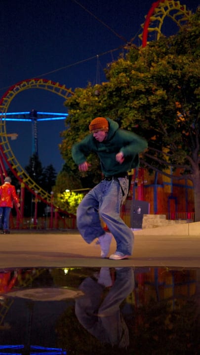 Vibrant Moves Under Neon Lights In Urban Park