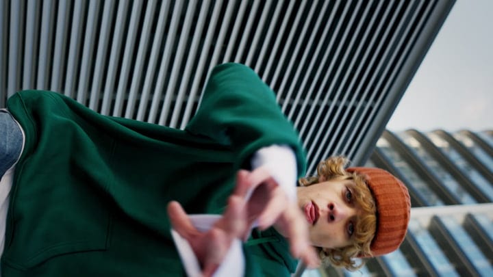 Street Dancer Reaches Out In Urban Night Scene