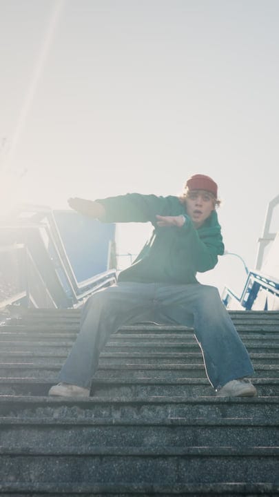 Street Dancer Leaps Into The Sunlit Urban Arena