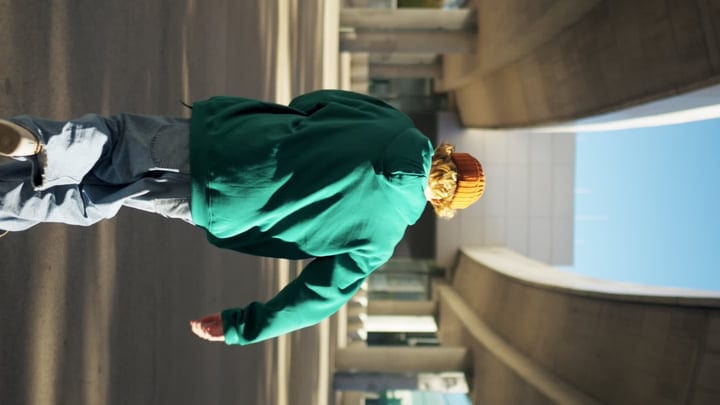 Urban Dancer Embraces the City Streets at Dusk