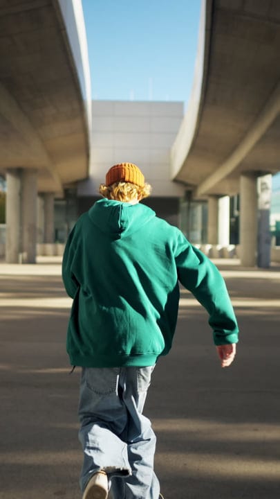Street Dancer Moves With Urban Confidence Under Bridge