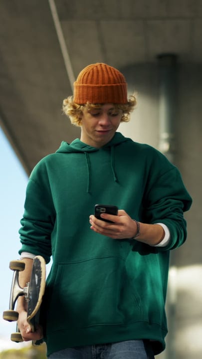 Youthful Energy On Display With Smartphone And Skateboard