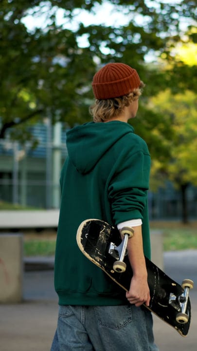 Casual Skater Relaxing in an Urban Park Setting