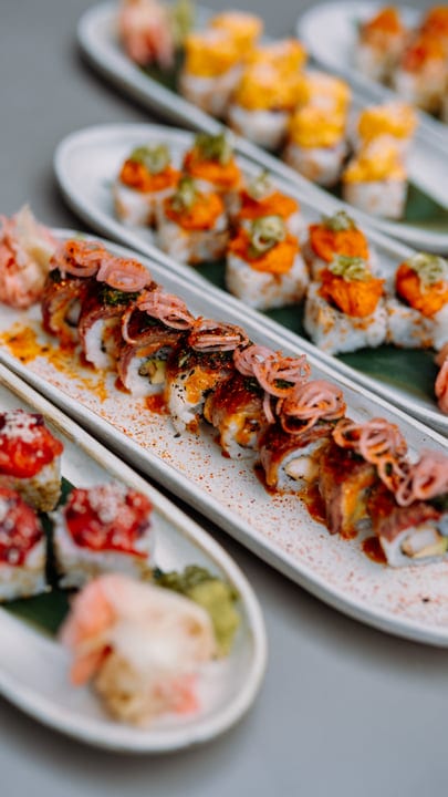 Colorful Sushi Rolls Adorn Elegant Serving Platters