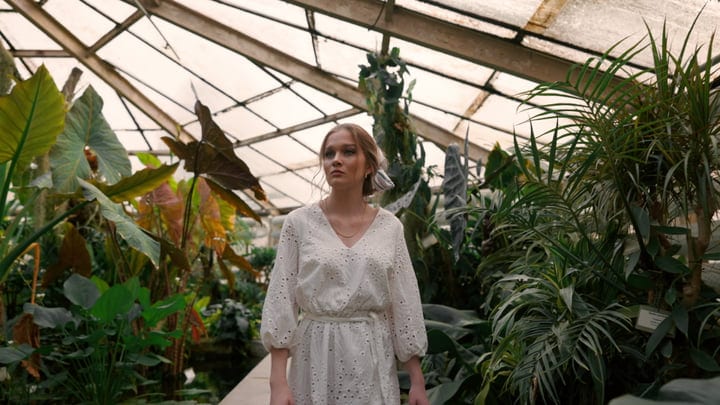 A Woman Strolls Through Lush Tropical Sanctuary