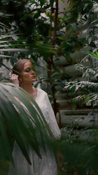 A Contemplative Moment Amidst Lush Tropical Foliage