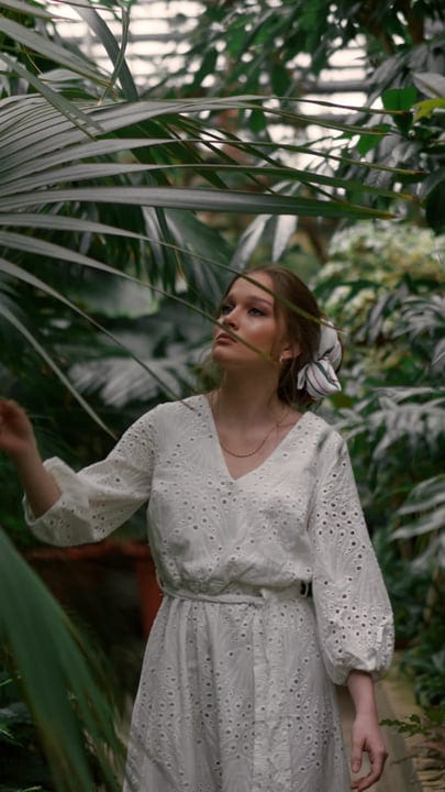 A Woman Finds Solace in a Lush Tropical Garden