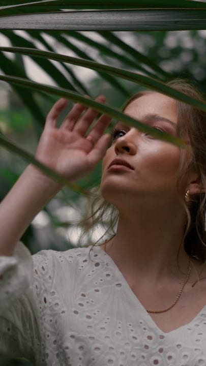 A Woman Embraces Serenity In A Tropical Oasis