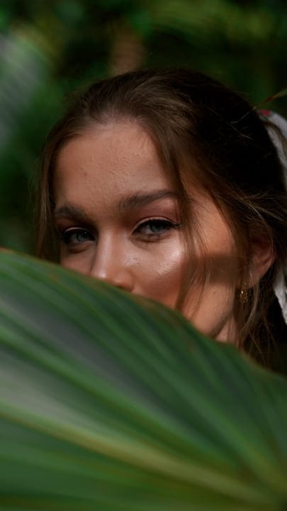 Glimpses Of Mystery Behind Lush Green Leaves
