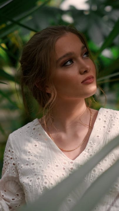 A Contemplative Moment In A Lush Tropical Garden