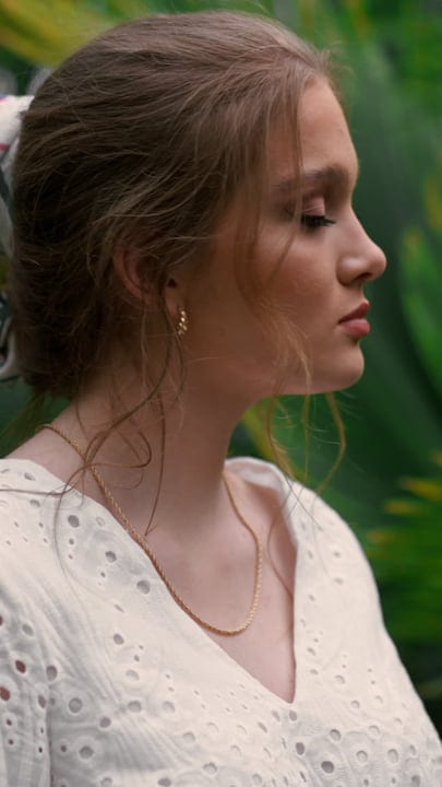 Contemplative Moment Amidst Lush Tropical Greenery