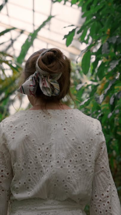 Back View Of Woman In Tropical Garden Serenity
