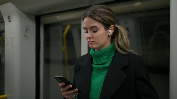 Focused Commuter Navigating Her Day On Copenhagen Metro
