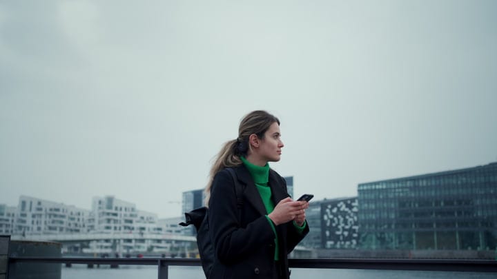Businesswoman Navigates Copenhagen Streets With Purpose
