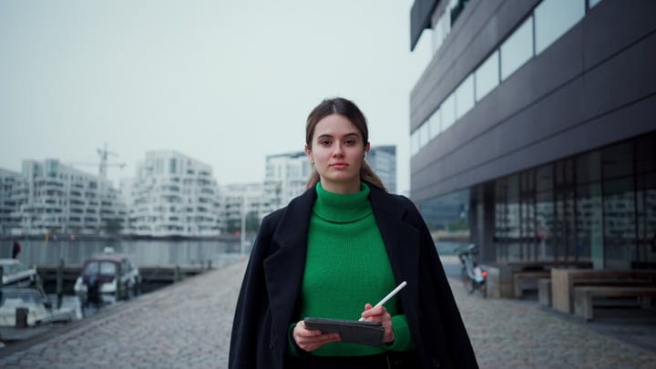 Confident Businesswoman Navigating Copenhagen's Urban Landscape